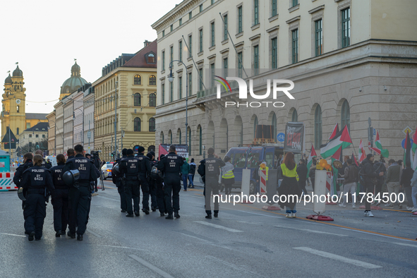 A demonstration in Munich, Germany, on November 16, 2024, includes pro-Palestinian demonstrators and pro-Israeli counter-demonstrators with...