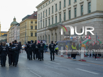 A demonstration in Munich, Germany, on November 16, 2024, includes pro-Palestinian demonstrators and pro-Israeli counter-demonstrators with...