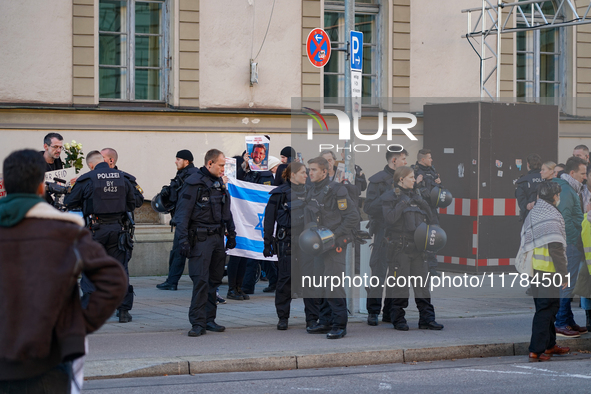 A demonstration in Munich, Germany, on November 16, 2024, includes pro-Palestinian demonstrators and pro-Israeli counter-demonstrators with...