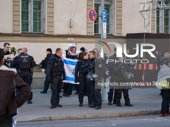 A demonstration in Munich, Germany, on November 16, 2024, includes pro-Palestinian demonstrators and pro-Israeli counter-demonstrators with...