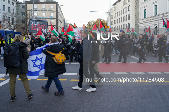 A demonstration in Munich, Germany, on November 16, 2024, includes pro-Palestinian demonstrators and pro-Israeli counter-demonstrators with...