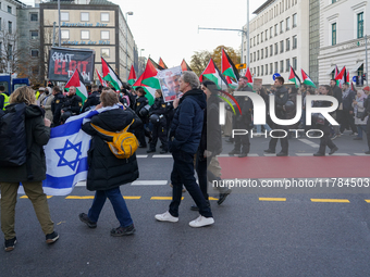 A demonstration in Munich, Germany, on November 16, 2024, includes pro-Palestinian demonstrators and pro-Israeli counter-demonstrators with...