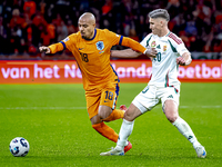 Netherlands forward Donyell Malen and Hungary forward Roland Sallai play during the match between the Netherlands and Hungary at the Johan C...