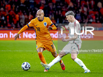 Netherlands forward Donyell Malen and Hungary forward Roland Sallai play during the match between the Netherlands and Hungary at the Johan C...