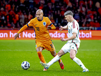 Netherlands forward Donyell Malen and Hungary forward Roland Sallai play during the match between the Netherlands and Hungary at the Johan C...