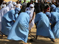 The photo, taken in Oued Souf, Algeria, on November 16, 2024, shows young Sahrawis playing a traditional game called taketchit during the In...