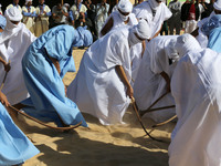 The photo, taken in Oued Souf, Algeria, on November 16, 2024, shows young Sahrawis playing a traditional game called taketchit during the In...