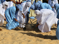 The photo, taken in Oued Souf, Algeria, on November 16, 2024, shows young Sahrawis playing a traditional game called taketchit during the In...