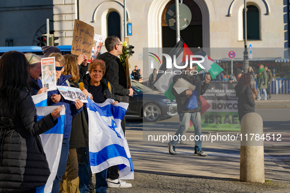 A demonstration in Munich, Germany, on November 16, 2024, includes pro-Palestinian demonstrators and pro-Israeli counter-demonstrators with...