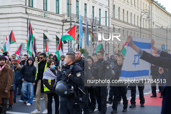 A demonstration in Munich, Germany, on November 16, 2024, includes pro-Palestinian demonstrators and pro-Israeli counter-demonstrators with...