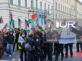 A demonstration in Munich, Germany, on November 16, 2024, includes pro-Palestinian demonstrators and pro-Israeli counter-demonstrators with...