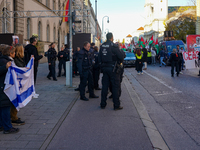 A demonstration in Munich, Germany, on November 16, 2024, includes pro-Palestinian demonstrators and pro-Israeli counter-demonstrators with...