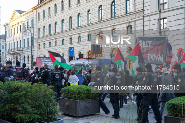 A demonstration in Munich, Germany, on November 16, 2024, includes pro-Palestinian demonstrators and pro-Israeli counter-demonstrators with...