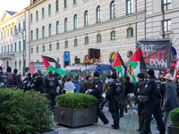 A demonstration in Munich, Germany, on November 16, 2024, includes pro-Palestinian demonstrators and pro-Israeli counter-demonstrators with...