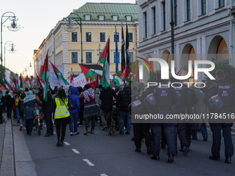 A demonstration in Munich, Germany, on November 16, 2024, includes pro-Palestinian demonstrators and pro-Israeli counter-demonstrators with...