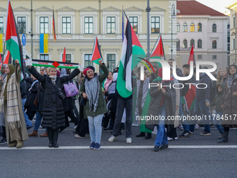 A demonstration in Munich, Germany, on November 16, 2024, includes pro-Palestinian demonstrators and pro-Israeli counter-demonstrators with...