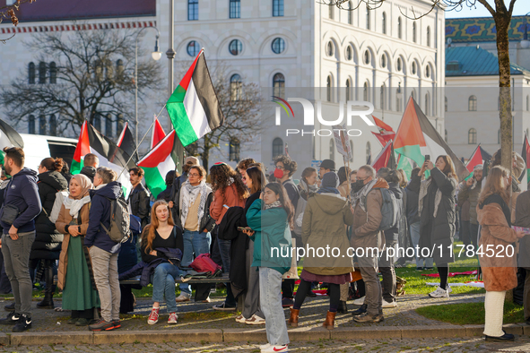 A demonstration in Munich, Germany, on November 16, 2024, includes pro-Palestinian demonstrators and pro-Israeli counter-demonstrators with...