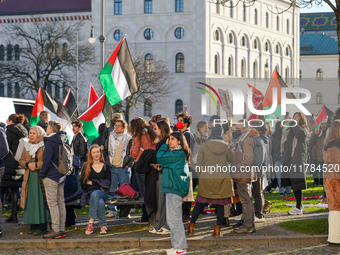 A demonstration in Munich, Germany, on November 16, 2024, includes pro-Palestinian demonstrators and pro-Israeli counter-demonstrators with...