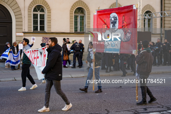 A demonstration in Munich, Germany, on November 16, 2024, includes pro-Palestinian demonstrators and pro-Israeli counter-demonstrators with...