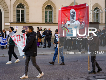 A demonstration in Munich, Germany, on November 16, 2024, includes pro-Palestinian demonstrators and pro-Israeli counter-demonstrators with...