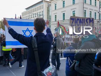 A demonstration in Munich, Germany, on November 16, 2024, includes pro-Palestinian demonstrators and pro-Israeli counter-demonstrators with...