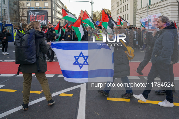 A demonstration in Munich, Germany, on November 16, 2024, includes pro-Palestinian demonstrators and pro-Israeli counter-demonstrators with...