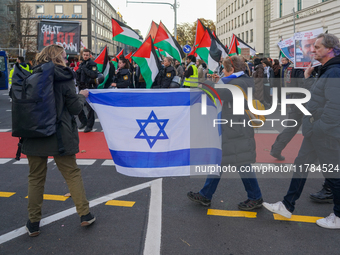 A demonstration in Munich, Germany, on November 16, 2024, includes pro-Palestinian demonstrators and pro-Israeli counter-demonstrators with...