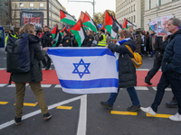 A demonstration in Munich, Germany, on November 16, 2024, includes pro-Palestinian demonstrators and pro-Israeli counter-demonstrators with...