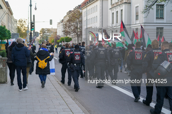 A demonstration in Munich, Germany, on November 16, 2024, includes pro-Palestinian demonstrators and pro-Israeli counter-demonstrators with...