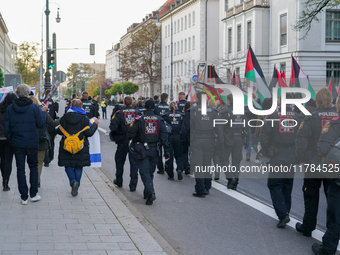 A demonstration in Munich, Germany, on November 16, 2024, includes pro-Palestinian demonstrators and pro-Israeli counter-demonstrators with...