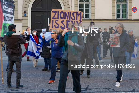 A demonstration in Munich, Germany, on November 16, 2024, includes pro-Palestinian demonstrators and pro-Israeli counter-demonstrators with...