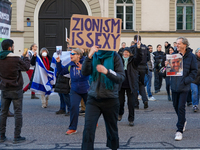 A demonstration in Munich, Germany, on November 16, 2024, includes pro-Palestinian demonstrators and pro-Israeli counter-demonstrators with...