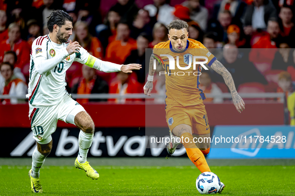 Hungary midfielder Dominik Szoboszlai and Netherlands forward Noa Lang participate in the match between the Netherlands and Hungary at the J...