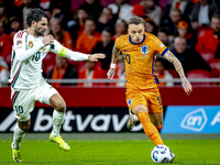 Hungary midfielder Dominik Szoboszlai and Netherlands forward Noa Lang participate in the match between the Netherlands and Hungary at the J...