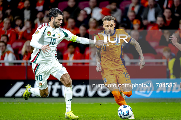 Hungary midfielder Dominik Szoboszlai and Netherlands forward Noa Lang participate in the match between the Netherlands and Hungary at the J...