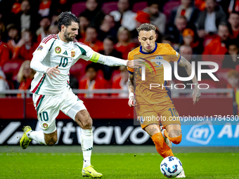 Hungary midfielder Dominik Szoboszlai and Netherlands forward Noa Lang participate in the match between the Netherlands and Hungary at the J...