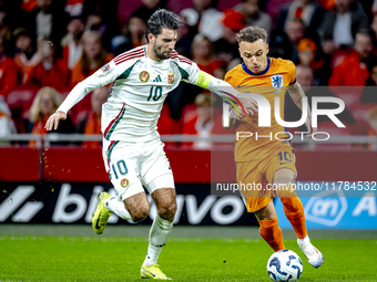 Hungary midfielder Dominik Szoboszlai and Netherlands forward Noa Lang participate in the match between the Netherlands and Hungary at the J...