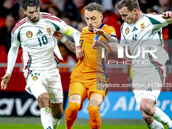 Hungary midfielder Dominik Szoboszlai and Netherlands forward Noa Lang participate in the match between the Netherlands and Hungary at the J...