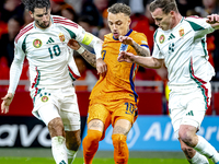 Hungary midfielder Dominik Szoboszlai and Netherlands forward Noa Lang participate in the match between the Netherlands and Hungary at the J...