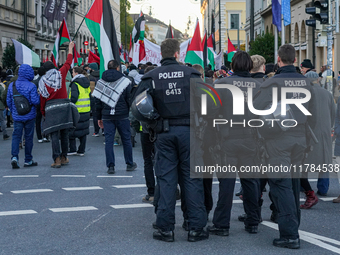 A demonstration in Munich, Germany, on November 16, 2024, includes pro-Palestinian demonstrators and pro-Israeli counter-demonstrators with...