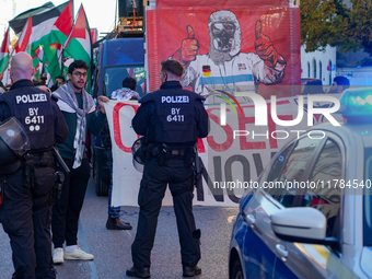 A demonstration in Munich, Germany, on November 16, 2024, includes pro-Palestinian demonstrators and pro-Israeli counter-demonstrators with...