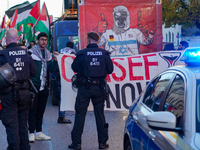 A demonstration in Munich, Germany, on November 16, 2024, includes pro-Palestinian demonstrators and pro-Israeli counter-demonstrators with...