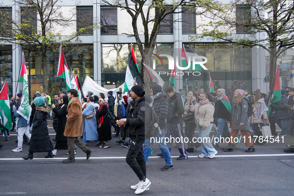 A demonstration in Munich, Germany, on November 16, 2024, includes pro-Palestinian demonstrators and pro-Israeli counter-demonstrators with...