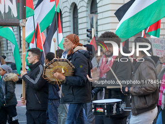 A demonstration in Munich, Germany, on November 16, 2024, includes pro-Palestinian demonstrators and pro-Israeli counter-demonstrators with...