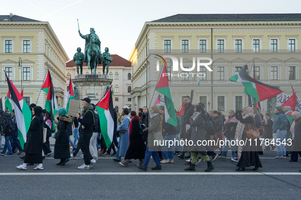 A demonstration in Munich, Germany, on November 16, 2024, includes pro-Palestinian demonstrators and pro-Israeli counter-demonstrators with...