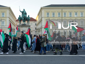 A demonstration in Munich, Germany, on November 16, 2024, includes pro-Palestinian demonstrators and pro-Israeli counter-demonstrators with...