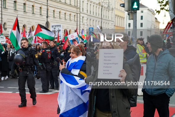 A demonstration in Munich, Germany, on November 16, 2024, includes pro-Palestinian demonstrators and pro-Israeli counter-demonstrators with...