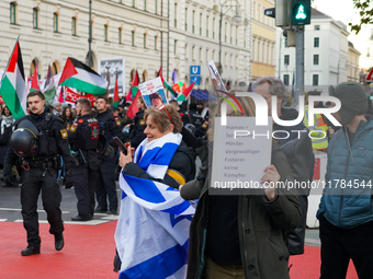 A demonstration in Munich, Germany, on November 16, 2024, includes pro-Palestinian demonstrators and pro-Israeli counter-demonstrators with...