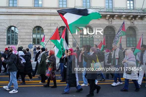 A demonstration in Munich, Germany, on November 16, 2024, includes pro-Palestinian demonstrators and pro-Israeli counter-demonstrators with...