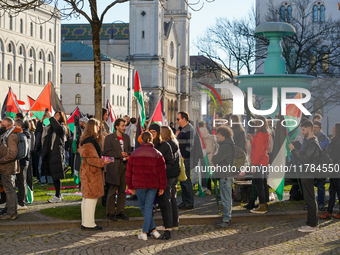 A demonstration in Munich, Germany, on November 16, 2024, includes pro-Palestinian demonstrators and pro-Israeli counter-demonstrators with...